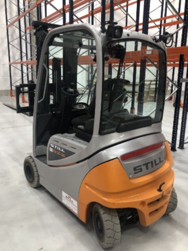 Forklift truck in the warehouse